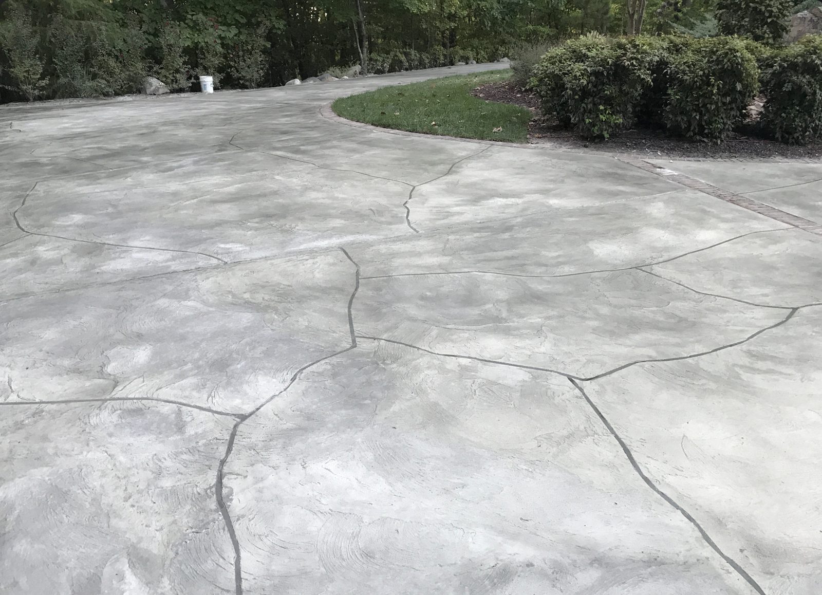Trowel overlay driveway with flagstone pattern